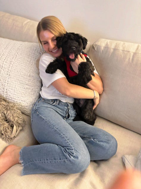 Photos of Britta and Theo, her new puppy, meeting for the first time. 