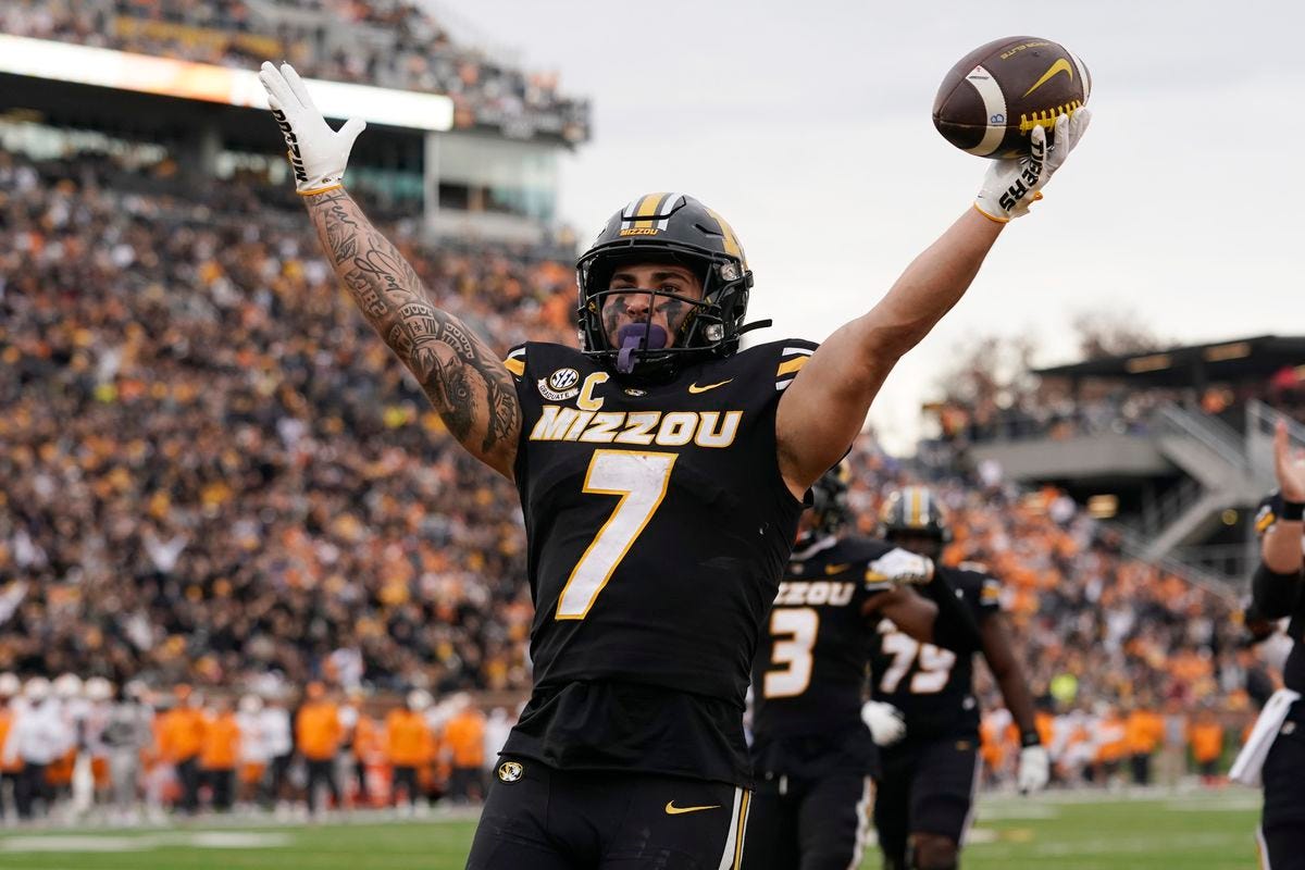 Missouri Tigers RB Cody Schrader celebrates his big day against Tennessee.