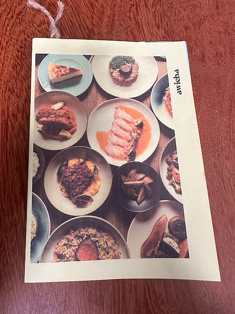 The pages of Awicha's menu including appetizers, duck dishes, mains, and an extensive beverage menu.