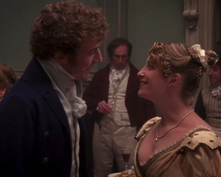 This may contain: a man and woman standing next to each other in front of people wearing period clothing