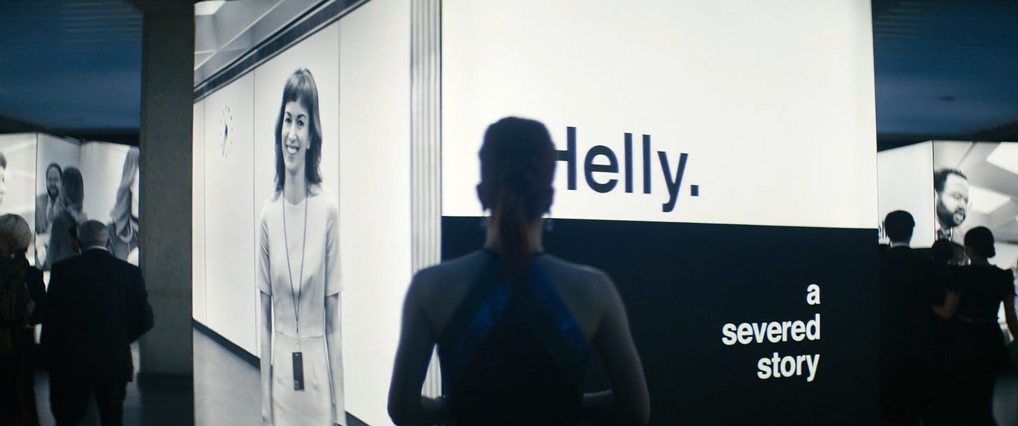 Helly looking at Lumon's Helly display