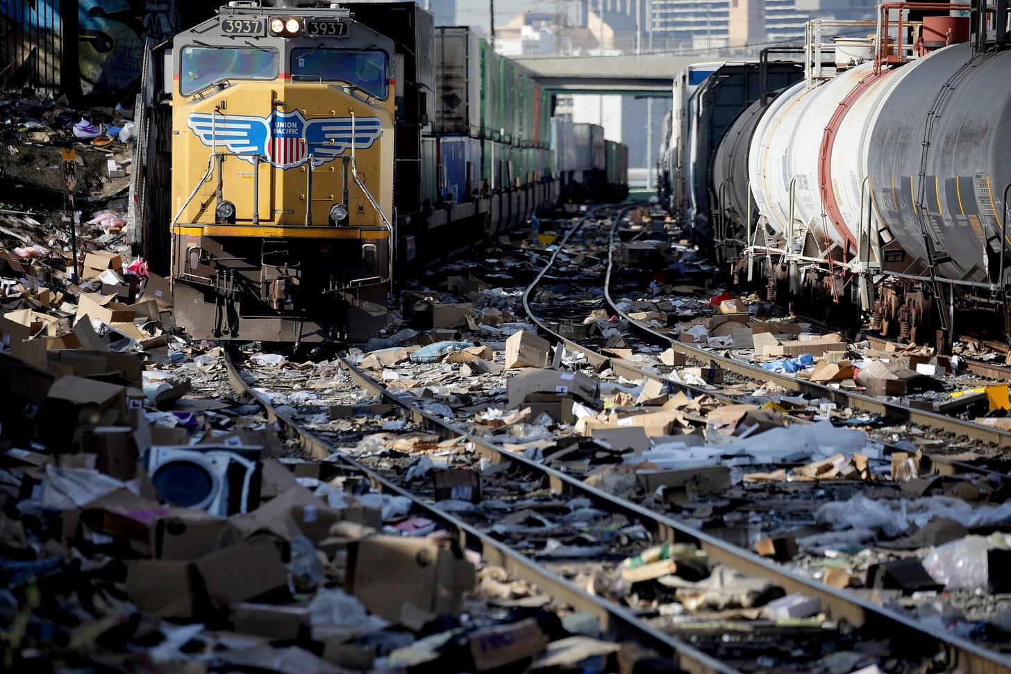 A Union Pacific freight train navigates the tracks in downtown Los Angeles