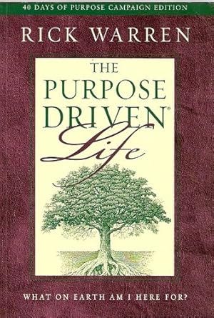 A book with a burgundy outline and a green tree in the middle. Title is The Purpose Driven Life and the author is Rick Warren.