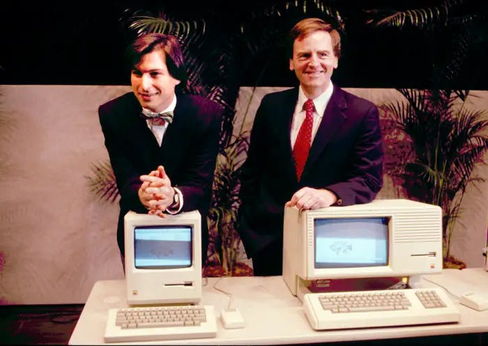 Steve Jobs and John Sculley showcasing early Apple Macintosh computers during the 1980s Silicon Valley boom Steve Jobs and John Sculley showcasing early Apple Macintosh computers during the 1980s Silicon Valley boom