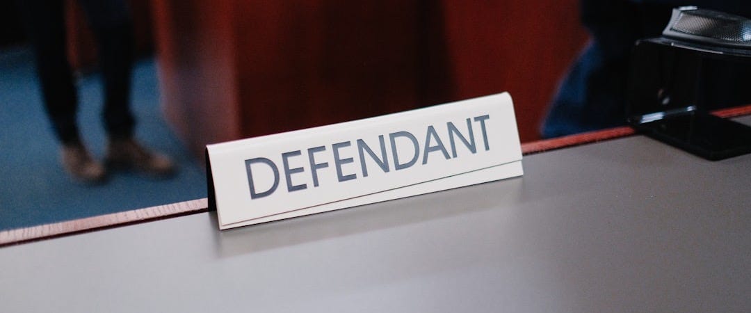 a desk with a sign on it that says defend a desk with a sign on it that says defend