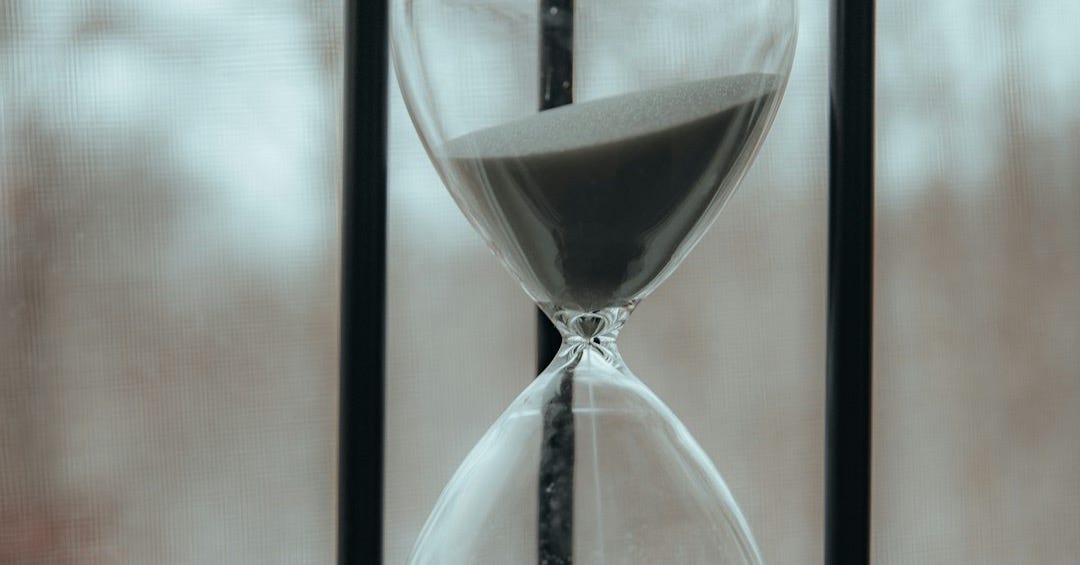 clear hour glass on table