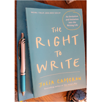 A blue book and a pen

Description automatically generated