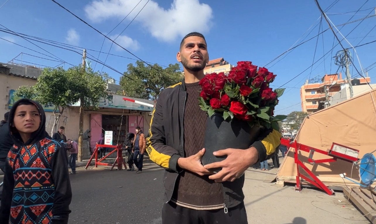 Hussam Abdulhadi, a displaced Palestinian florist, sells flowers, in Rafah Hussam Abdulhadi, a displaced Palestinian florist, sells flowers, in Rafah