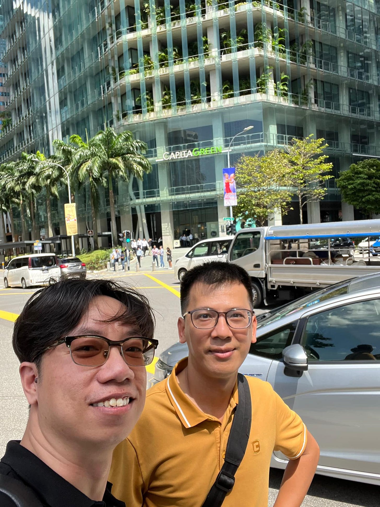May be an image of 2 people, people standing and road