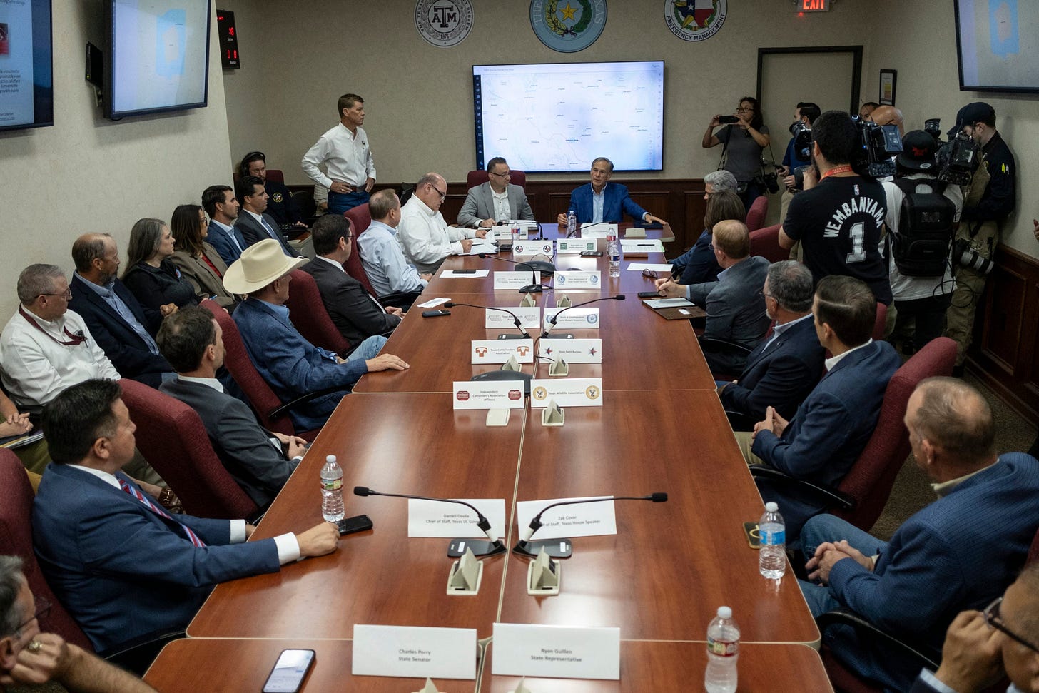 AUSTIN, TEXAS - JUNE 5: Michael Schmoyer, director of the New World Screwworm Directorate for the United States Department of Agriculture, and Texas Gov. Greg Abbott attend a meeting with government officials discussing the New World Screwworm threat at the Texas Division of Emergency Management State Operations Center on June 5, 2026 in Austin, Texas. The first case of New World Screwworm infection, since its eradication from the country in 1966, was reported in Texas Wednesday by the United States Department of Agriculture. (Photo by Joel Angel Juarez/Getty Images)
