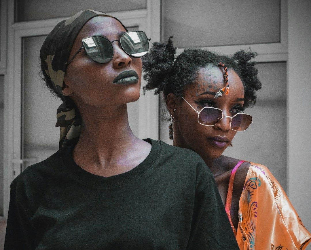 woman in black crew neck t-shirt wearing black sunglasses woman in black crew neck t-shirt wearing black sunglasses