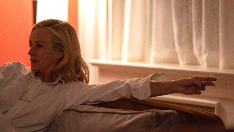 Julianne Moore in After the Hunt, a Luca Guadagnino film. Moore is reclining, smoking. Review image.