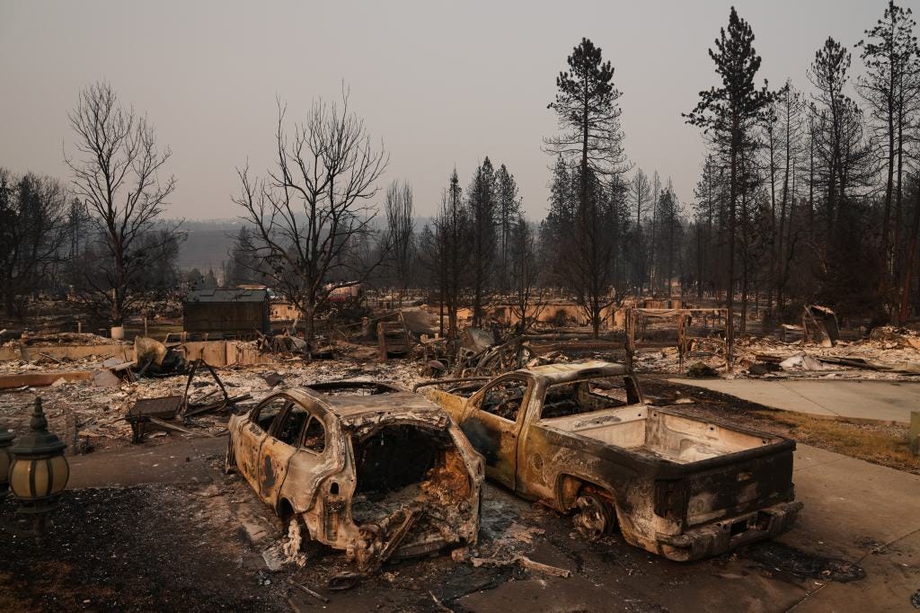 Dozens of homes are seen burned to the ground after a wildfire hit the northern part of Spokane, Wash., Monday, Aug. 3, 2026. Dozens of homes are seen burned to the ground after a wildfire hit the northern part of Spokane, Wash., Monday, Aug. 3, 2026.