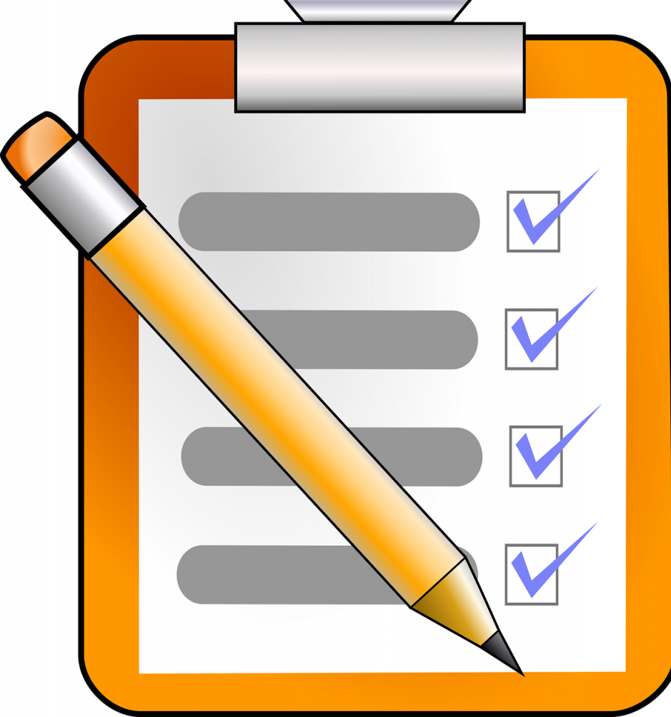 Writing check list on clipboard with a pencil laying across the top with several items checked off Writing check list on clipboard with a pencil laying across the top with several items checked off