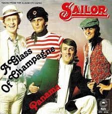 On this day in 1975, the Sailor single “A Glass of Champagne” debuted on  the UK Singles Chart at #44 (December 6) The jangly keyboard rocker,  written by the group's lead singer