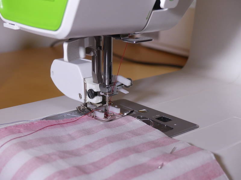 sewing the red fabric