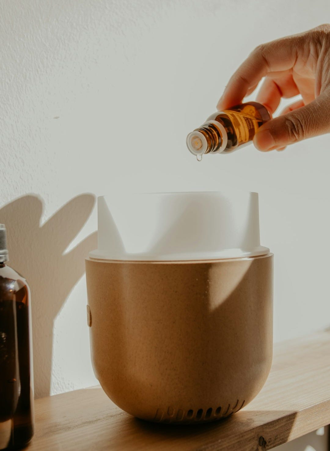 person holding brown and white cup