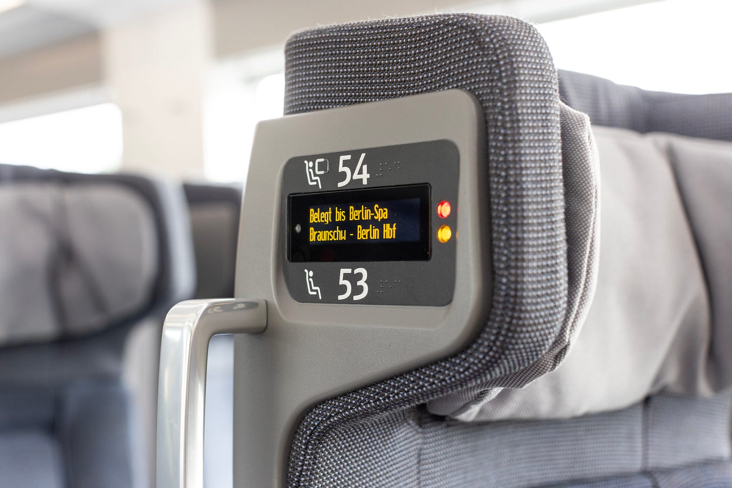 Seat numbers in Braille and tactile numbers on the side of the seat