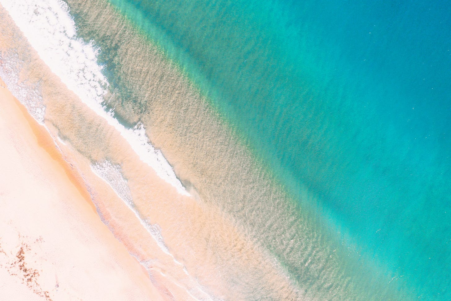 aerial photography teal body of water and shore aerial photography teal body of water and shore