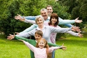 a family in a line with their arms out