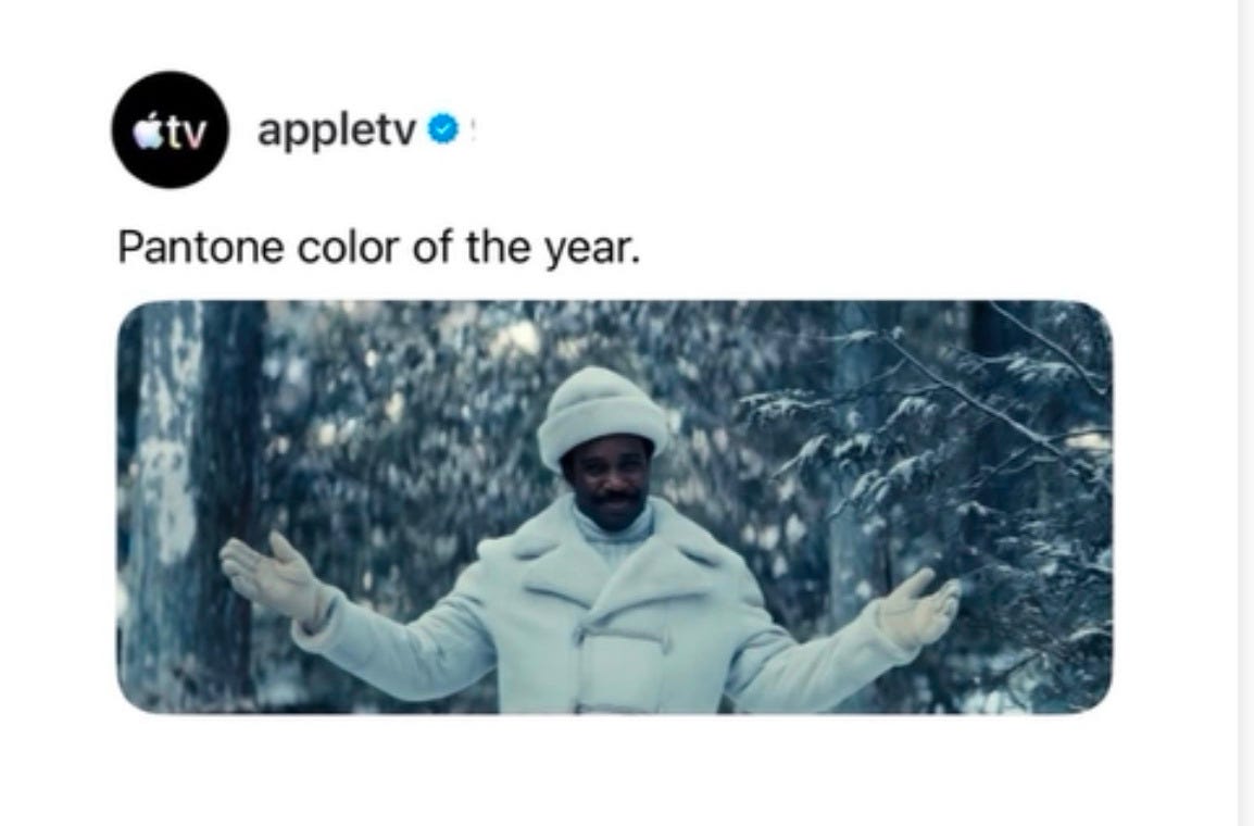 An AppleTV ad showing Mr. Milchek in a white puffer jacket in a snowy forest from the show Severance. An AppleTV ad showing Mr. Milchek in a white puffer jacket in a snowy forest from the show Severance.
