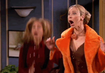 two women are standing next to each other with their mouths open . two women are standing next to each other with their mouths open .