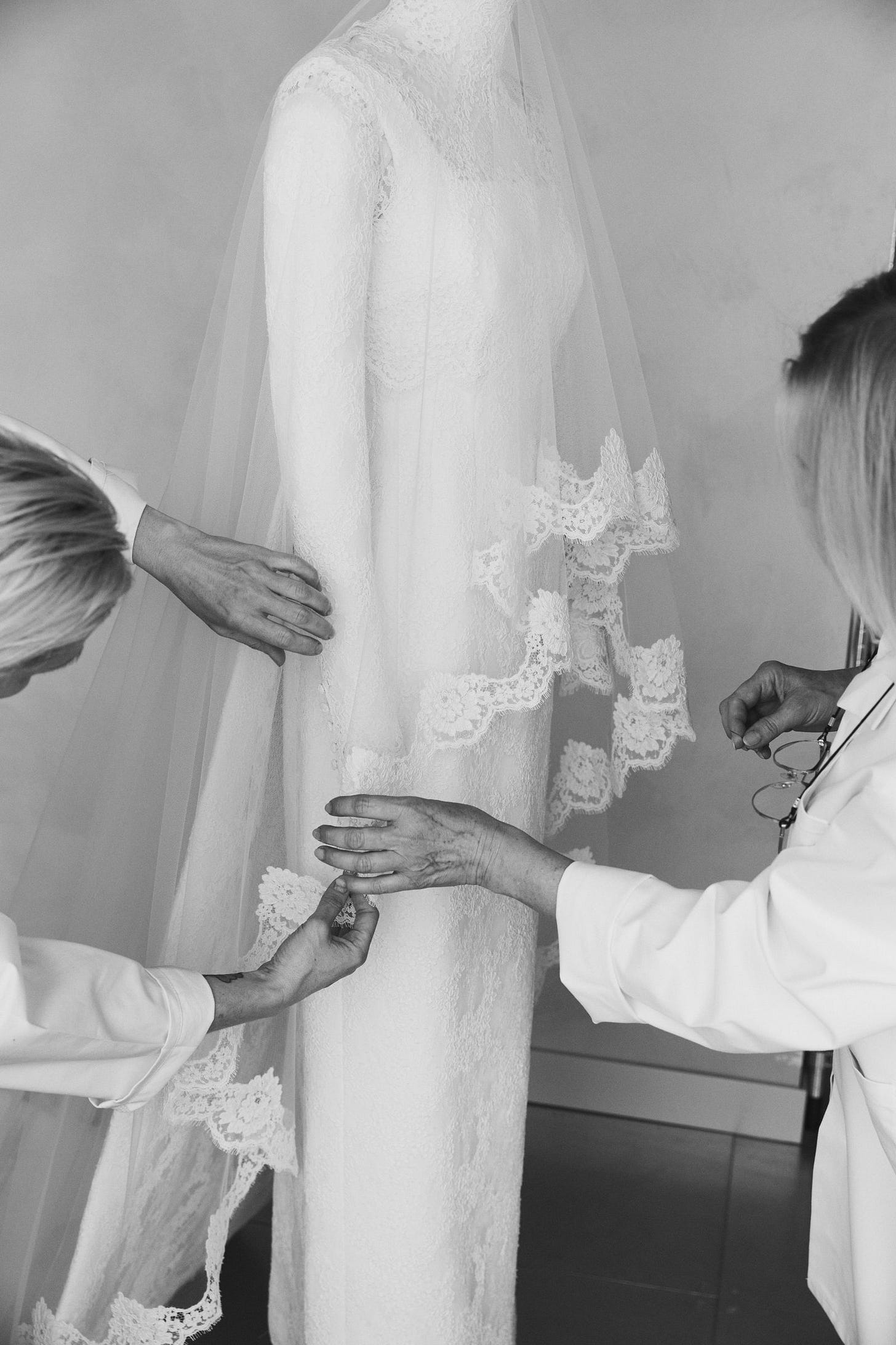 Image may contain Clothing Dress Fashion Formal Wear Gown Wedding Wedding Gown Bridal Veil Person and Adult