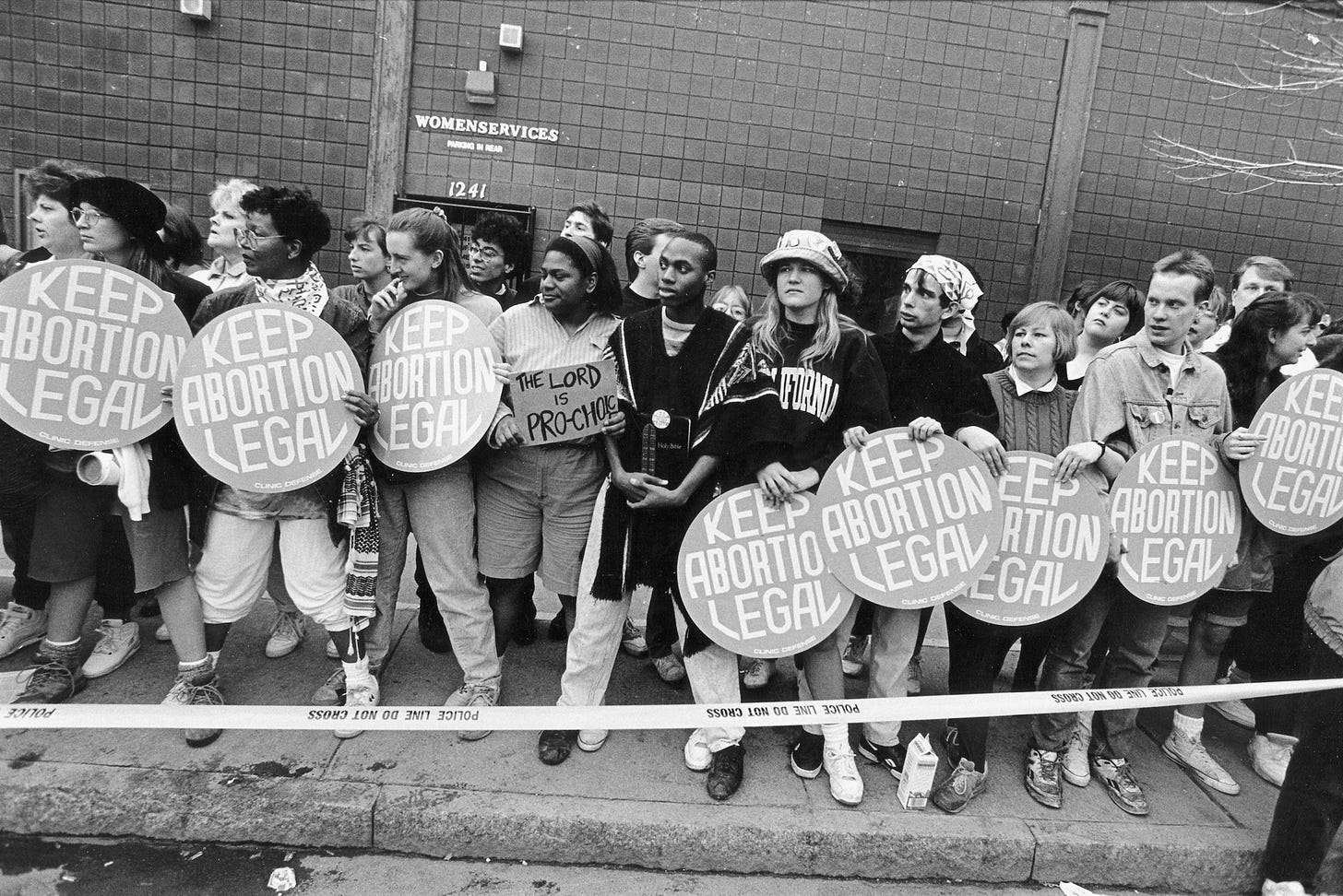 A clinic entrance is defended by supporters of legal abortion.