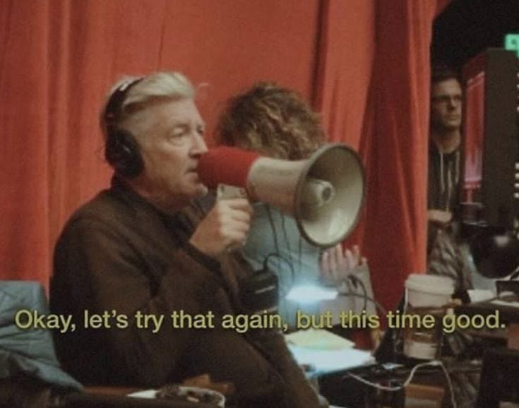 This may contain: a man holding a megaphone in front of a red curtain with the words okay, let's try that again, but this time good