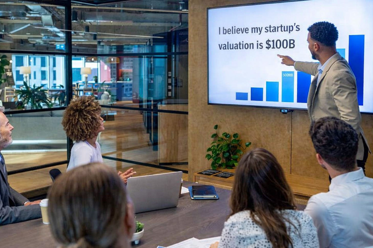 Founder pitching a $100B startup valuation to investors during a pre-seed meeting Founder pitching a $100B startup valuation to investors during a pre-seed meeting