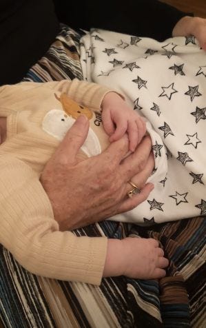 My 5-week old granddaughter's little fingers curled around mine. Bliss!