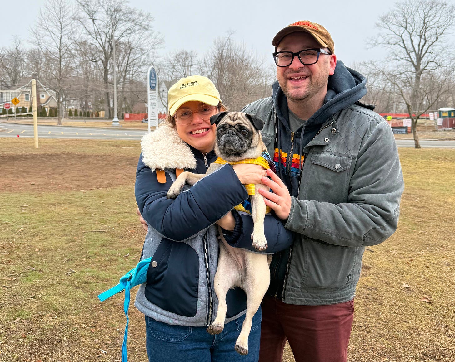 Me and Maris and Maggie, meeting for the first time in a park. We're holding her up.