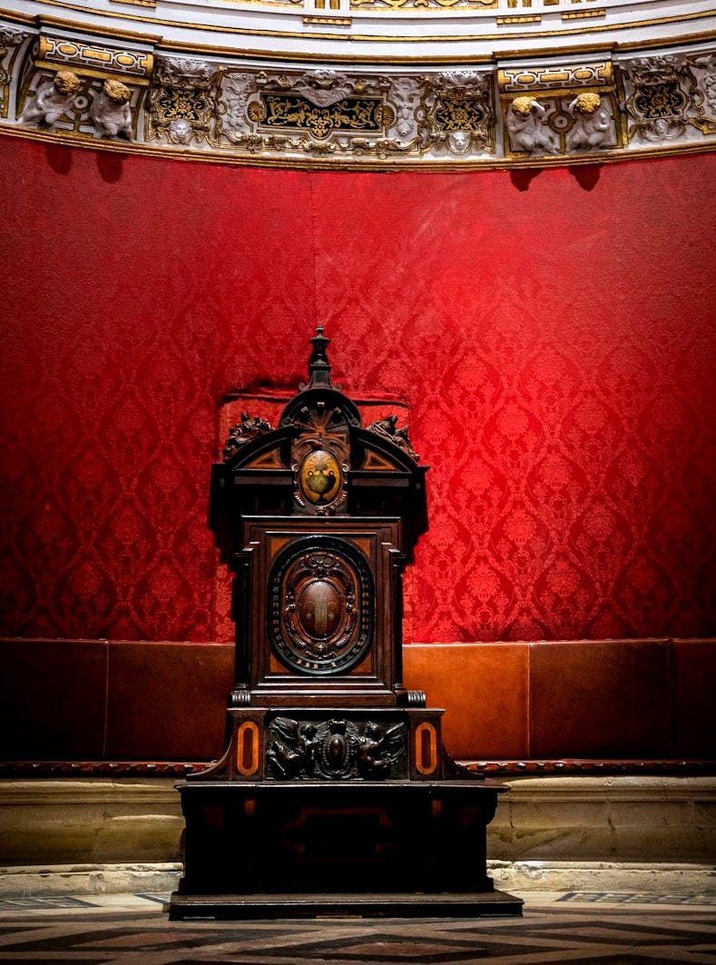 a clock sitting in the middle of a room a clock sitting in the middle of a room