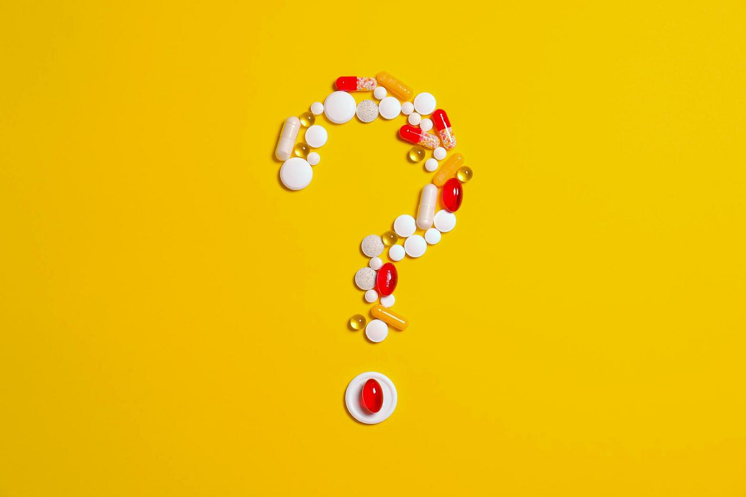 medication pills isolated on yellow background