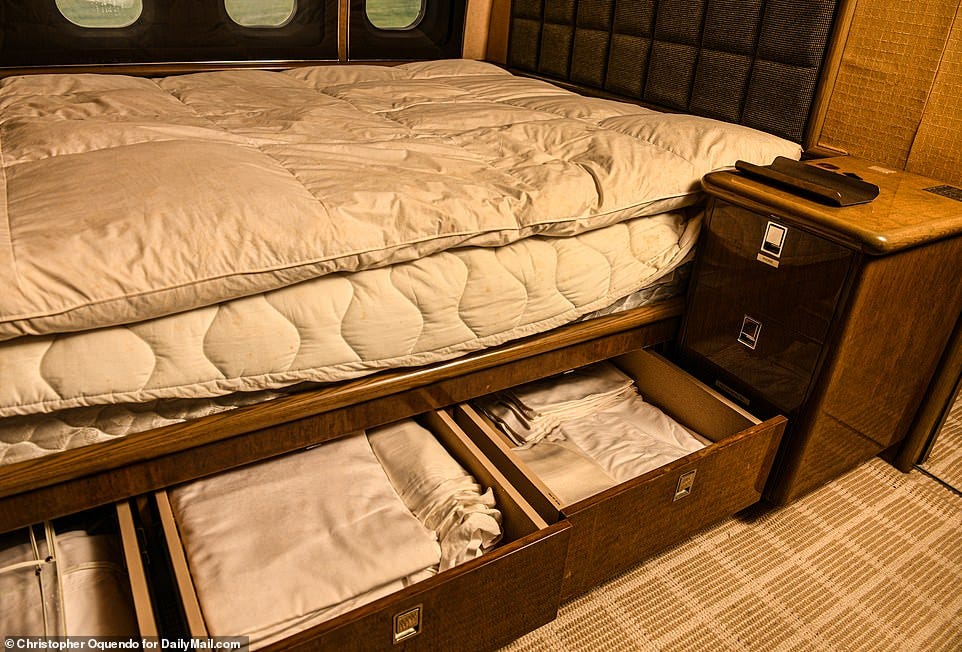 Exclusive images taken by DailyMail.com show the large bed in the rear bedroom cabin of Epstein's plane that is stocked with extra linens