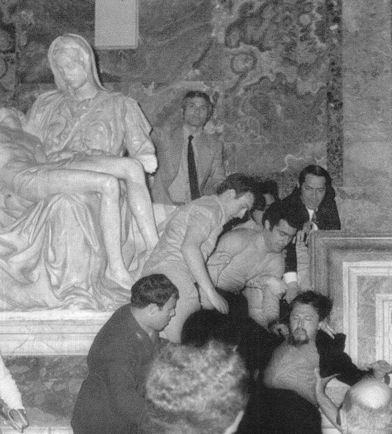 Lazslo Toth being dragged away from Michelangelo's Pieta Lazslo Toth being dragged away from Michelangelo's Pieta
