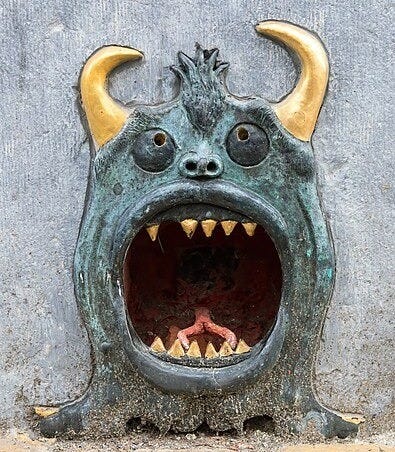 File:Relief of a devil's head with golden horns and sharp teeth in Rue du Grand Hospice Brussels Belgium.jpg