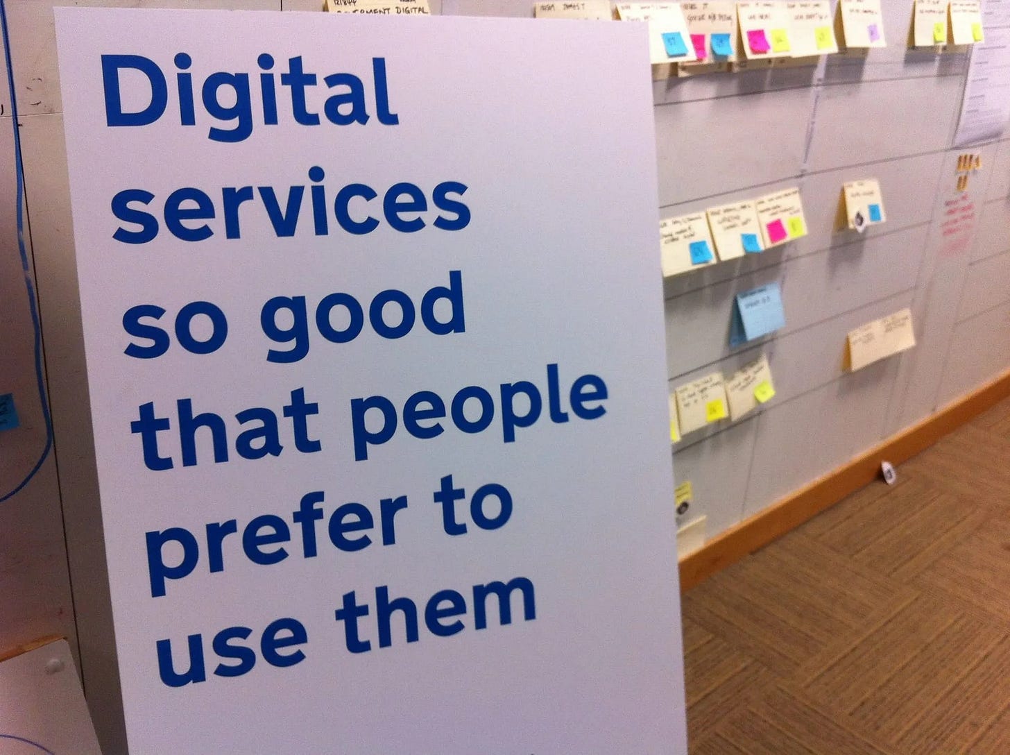 Sign that says "Digital services so good that people prefer to use them" Sign that says "Digital services so good that people prefer to use them"