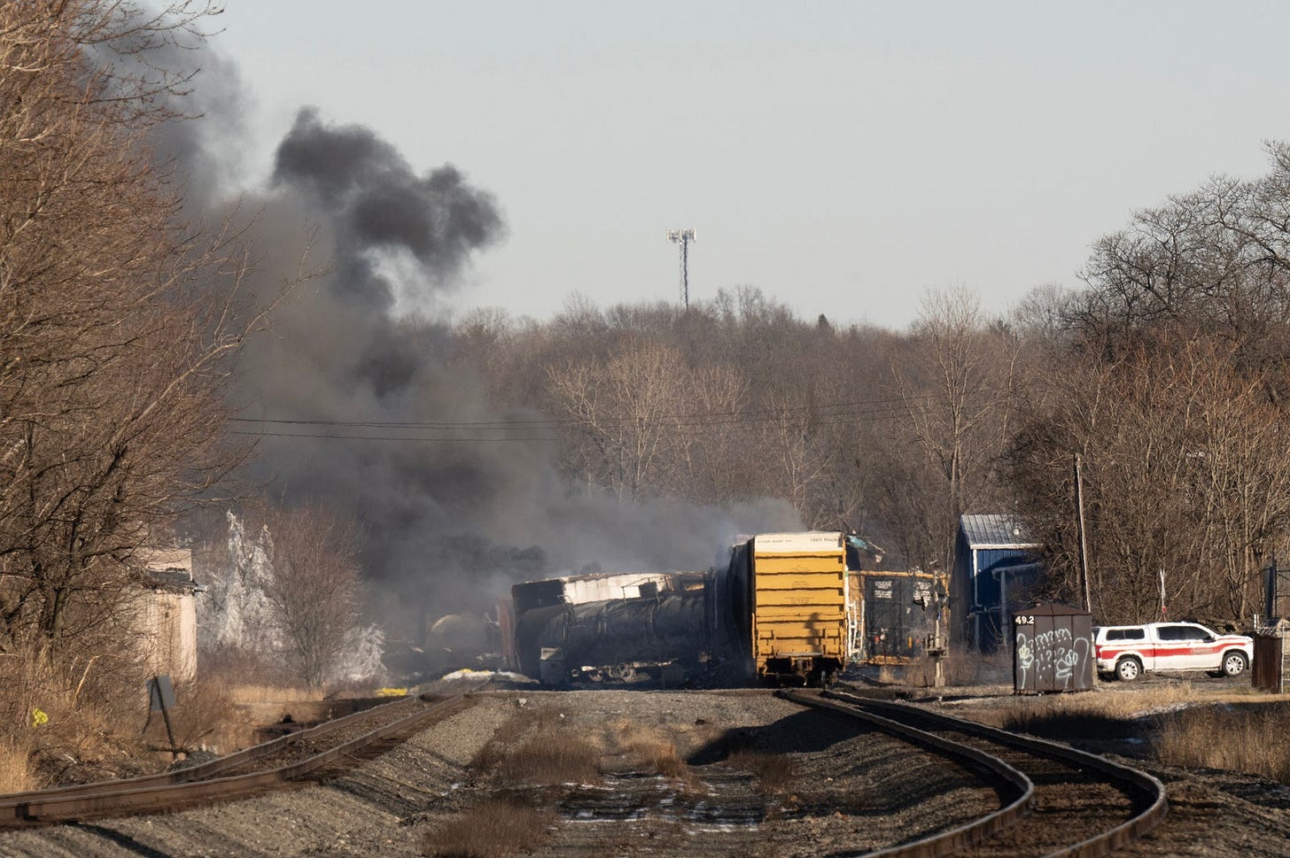 Train tracks and smoke.