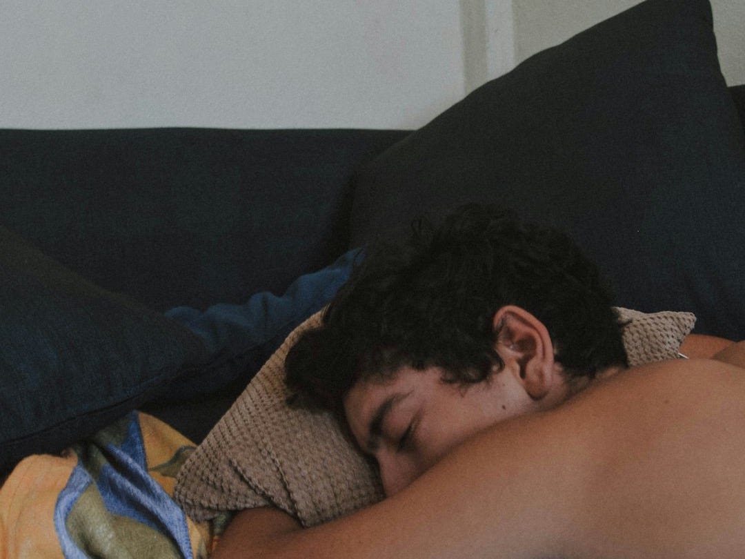 man lying on bed