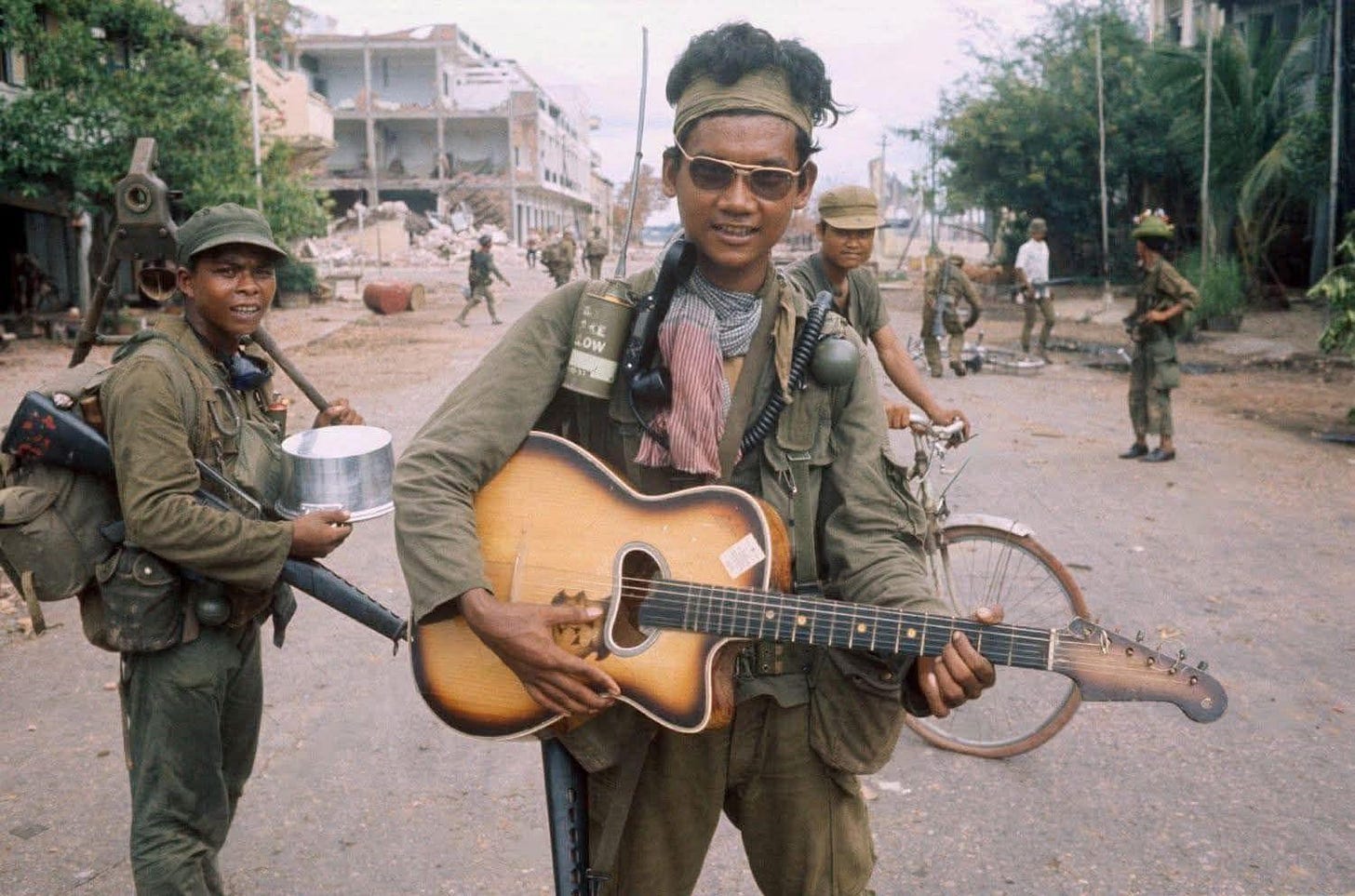 A former Mike Force soldier bravely fighting for the Khmer Republic in Tonle Bet, Cambodia, 1970, amidst the turmoil of the Cambodian Civil War.