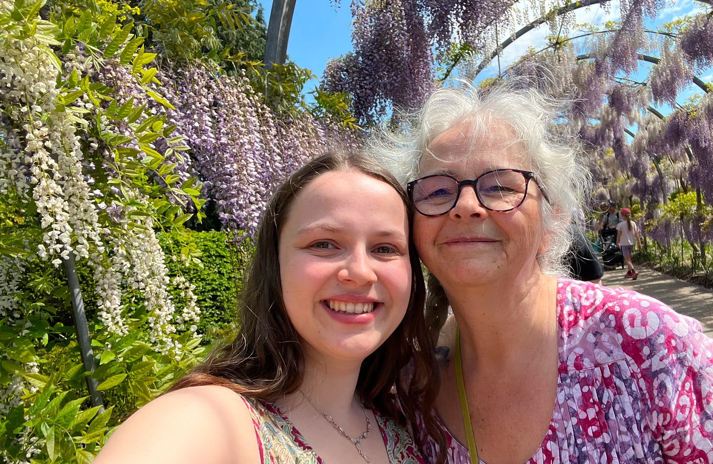 Blossom and her Mother in front of a Wisteria walk way