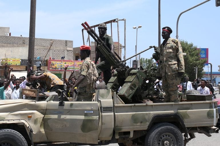 Sudanese greet army soldiers, loyal to army chief Abdel Fattah al-Burhan, in the Red Sea city of Port Sudan Sudanese greet army soldiers, loyal to army chief Abdel Fattah al-Burhan, in the Red Sea city of Port Sudan