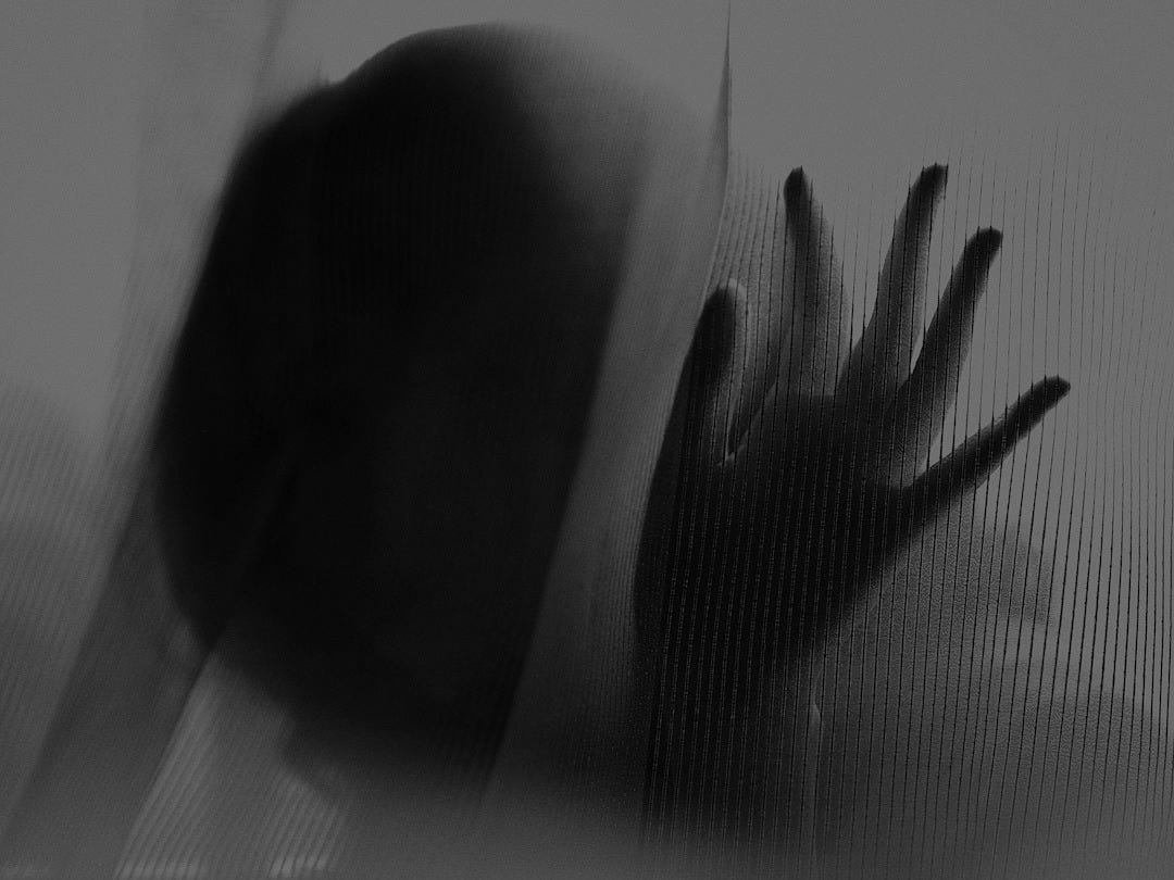 woman touching white textile