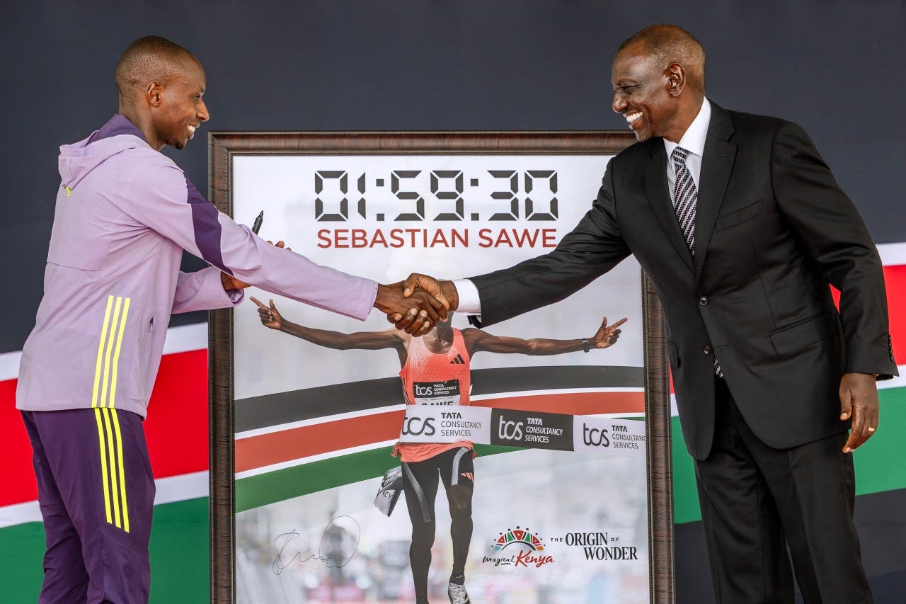 Kenya's President William Ruto congratulates Sabastian Sawe in Nairobi on April 30.