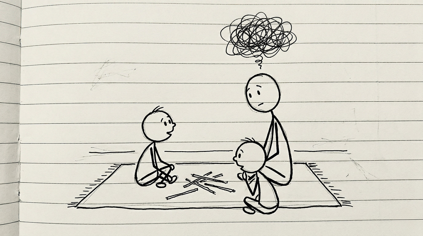 A grandfather sits on the floor playing pick-up sticks with two young grandchildren, distracted while they look toward him for attention. A grandfather sits on the floor playing pick-up sticks with two young grandchildren, distracted while they look toward him for attention.