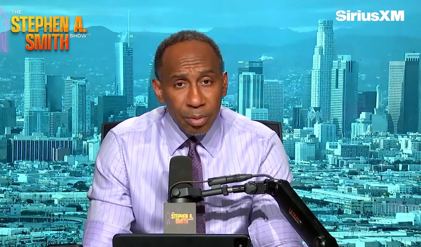 Stephen A. Smith at his desk on The Stephen A. Smith Show on SiriusXM with the Los Angeles skyline behind him Stephen A. Smith at his desk on The Stephen A. Smith Show on SiriusXM with the Los Angeles skyline behind him