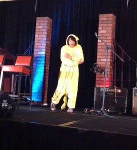 Lauren onstage at ChiCon cosplaying Pikachu