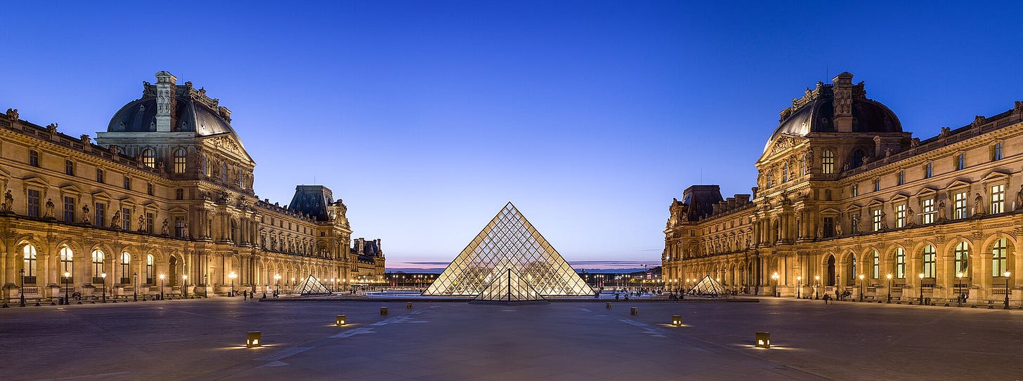 The glass pyramid entrance of the Louvre Museum in Paris The glass pyramid entrance of the Louvre Museum in Paris