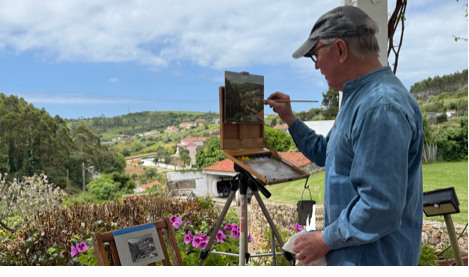 A person painting a picture on a stand

AI-generated content may be incorrect.